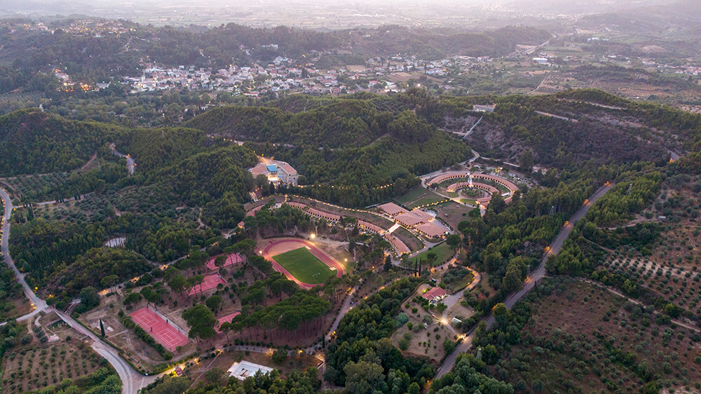 Aerial view of the International Olympic Academy campus, with the town of Ancient Olympia in the background.