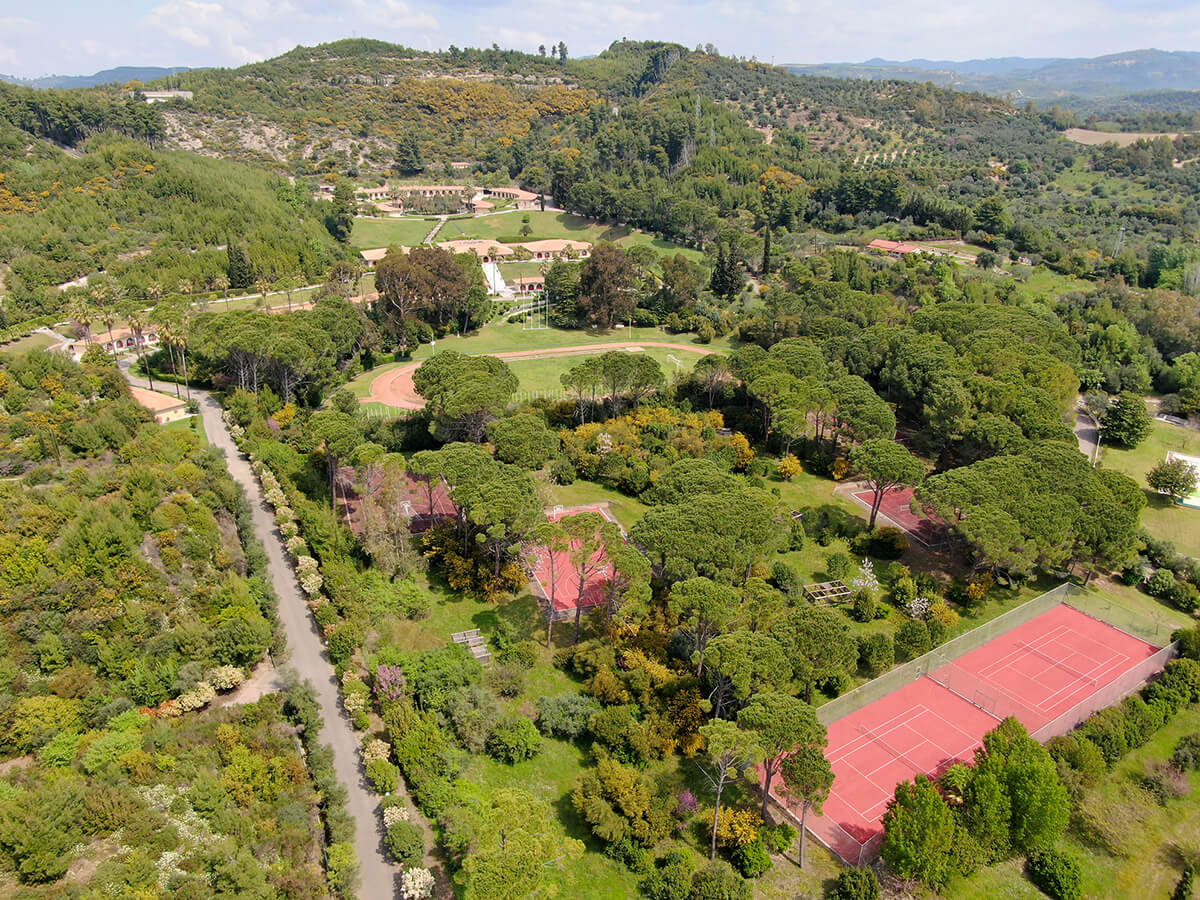 Outdoor courts, athletics track and wooded grounds at the International Olympic Academy in Ancient Olympia.